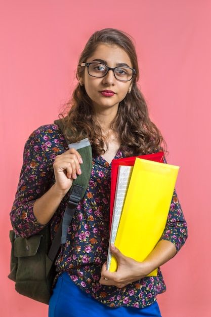 Premium Photo _ Indian girl student in glasses with folders and books